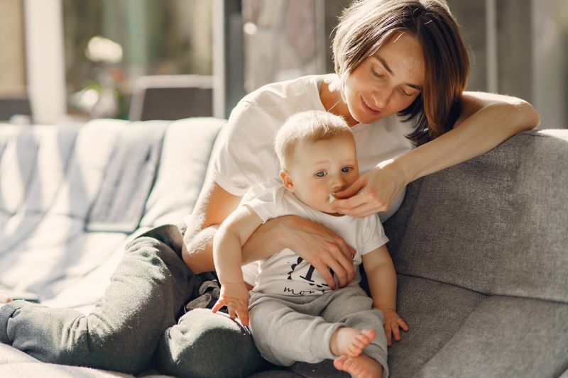 Babysitter caring for a baby with warmth and affection