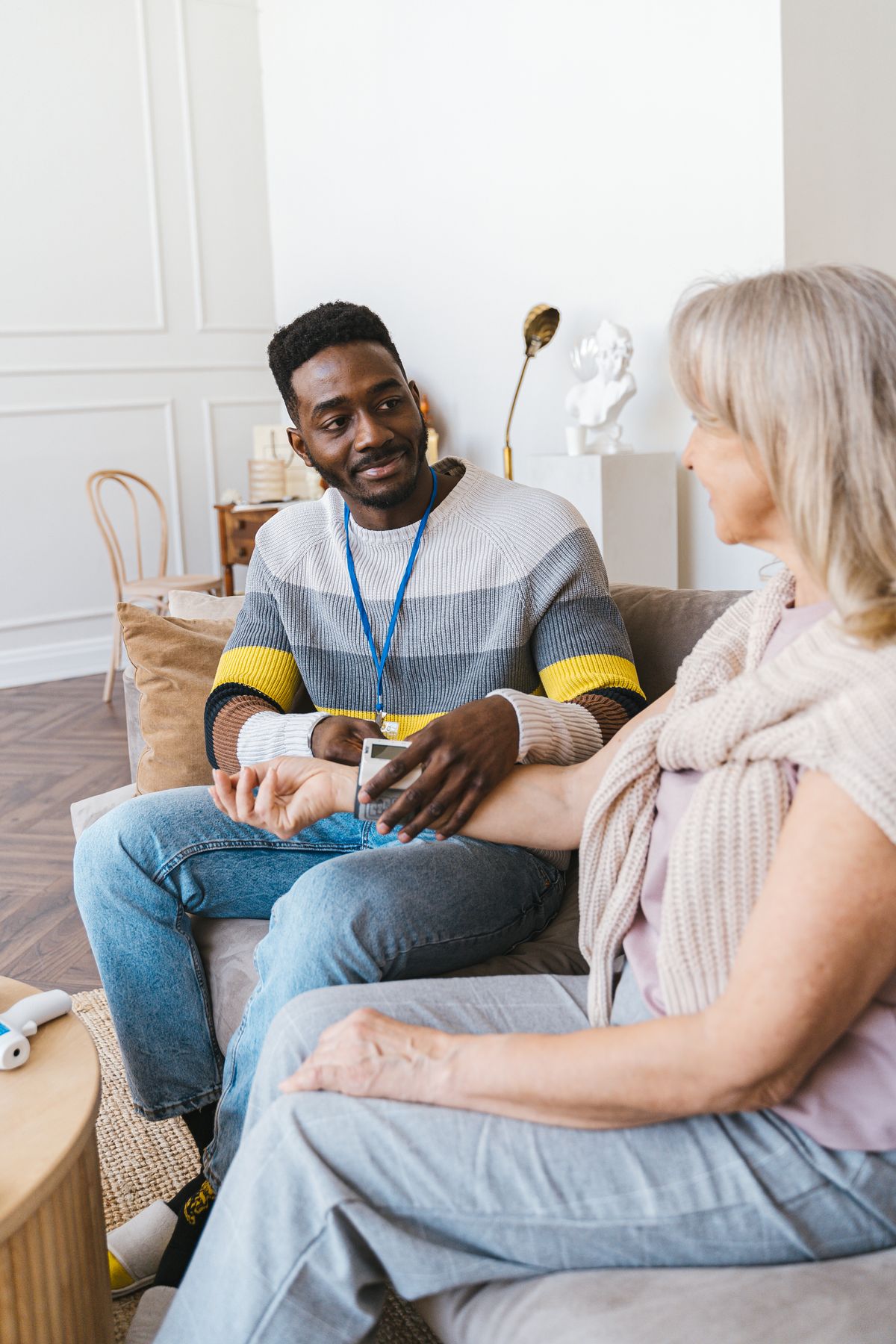Home care professional accompanying an elderly patient at home